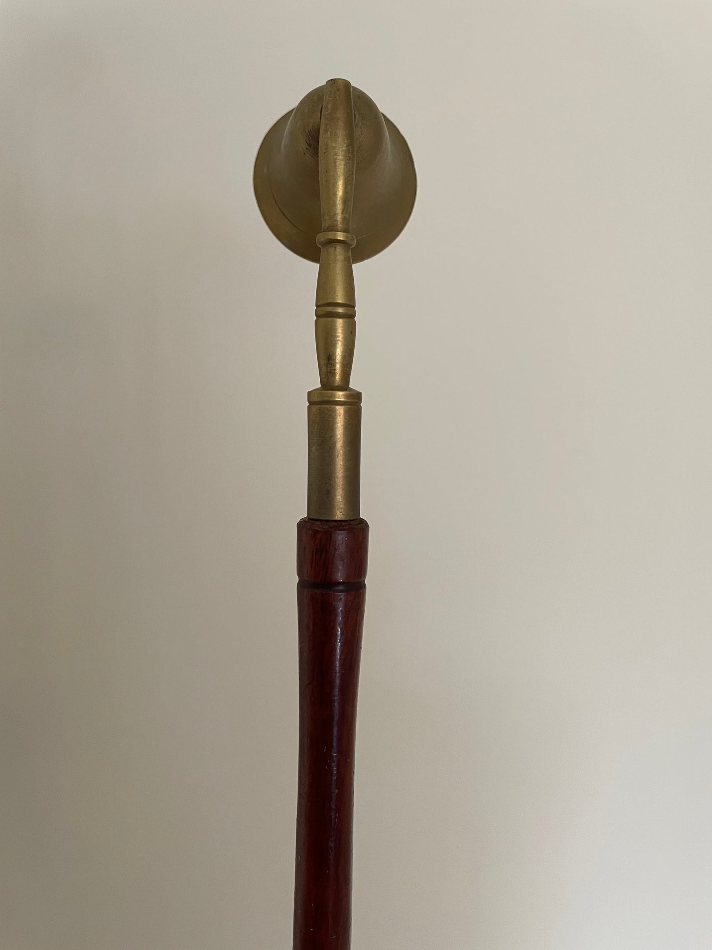 Brass and wooden candle snuffer