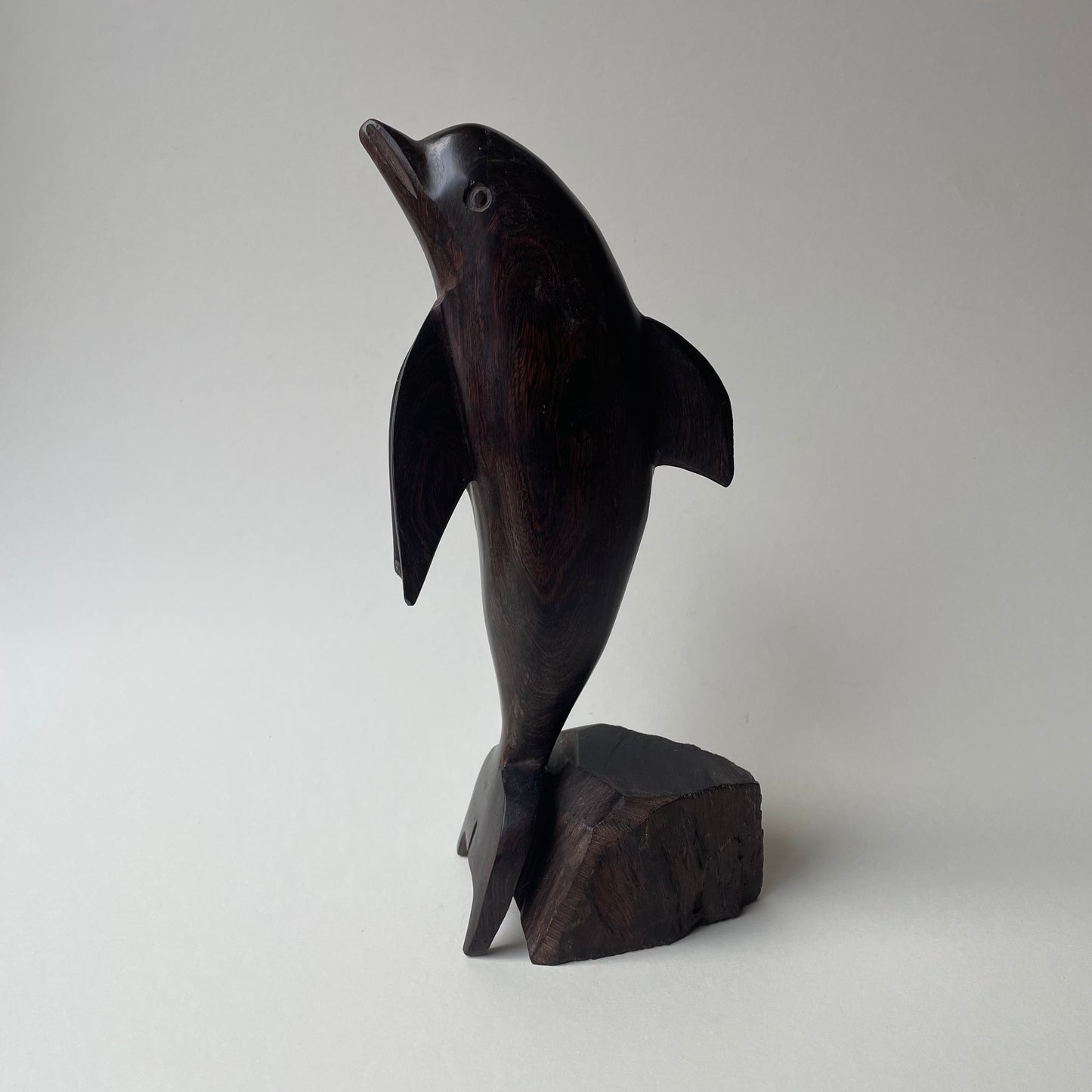 Large wooden dolphin statue