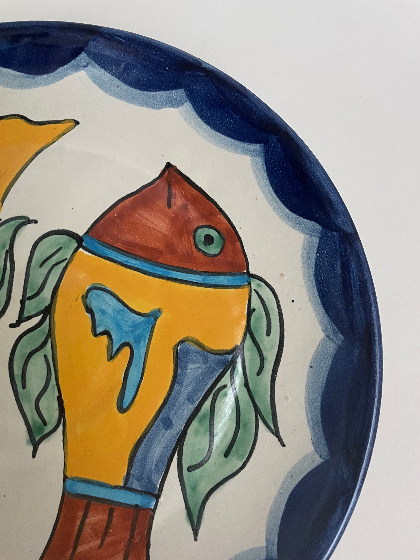 Vintage hand painted Mexican wall plate of colourful fish
