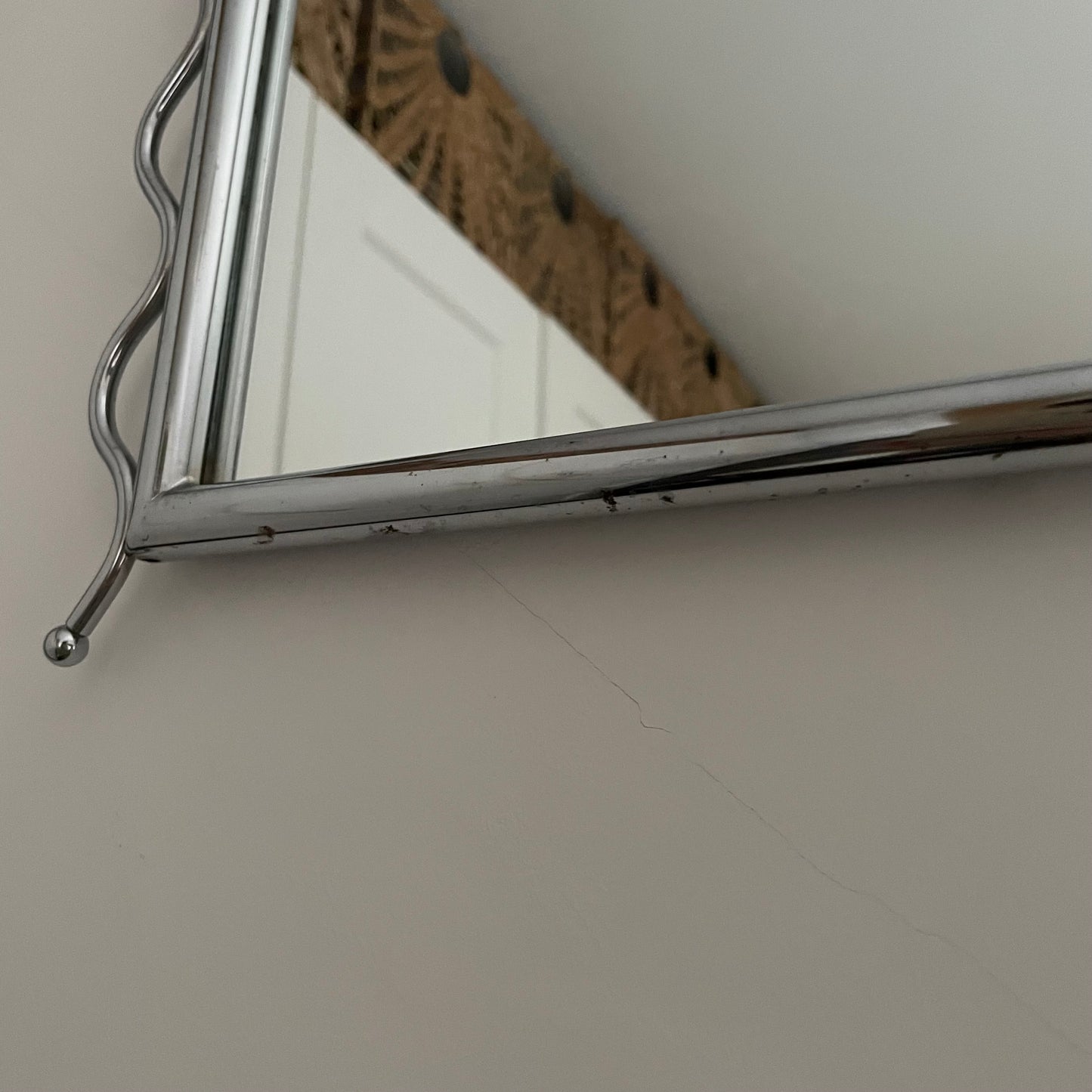 Chrome vintage mirror with wavy edges