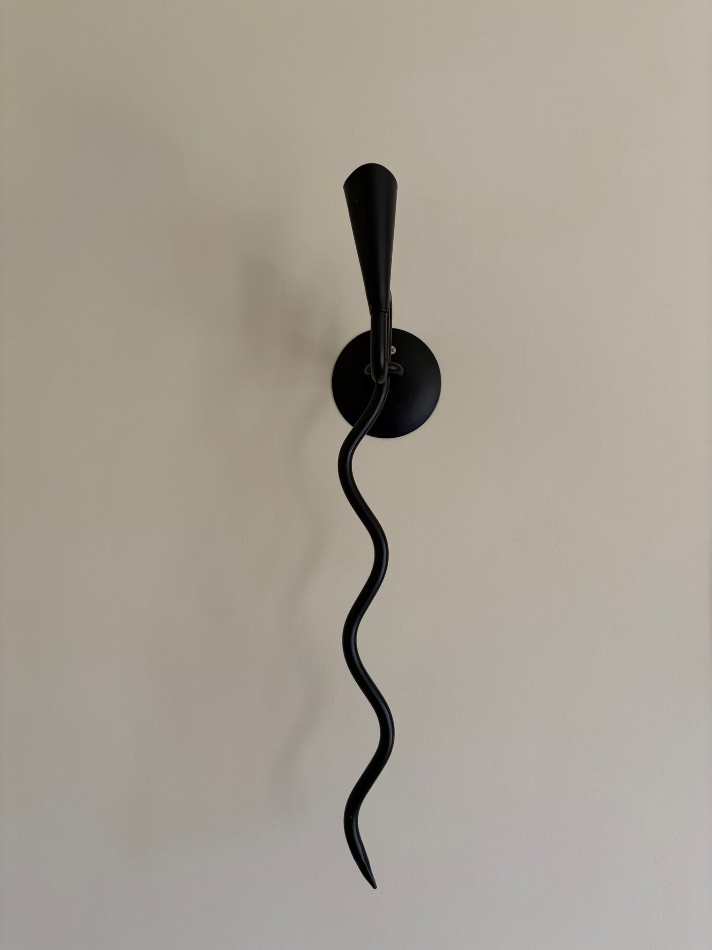 Pair of vintage wrought iron black squiggle candle wall sconces