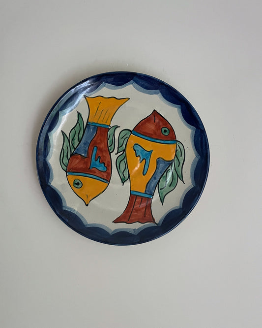 Vintage hand painted Mexican wall plate of colourful fish