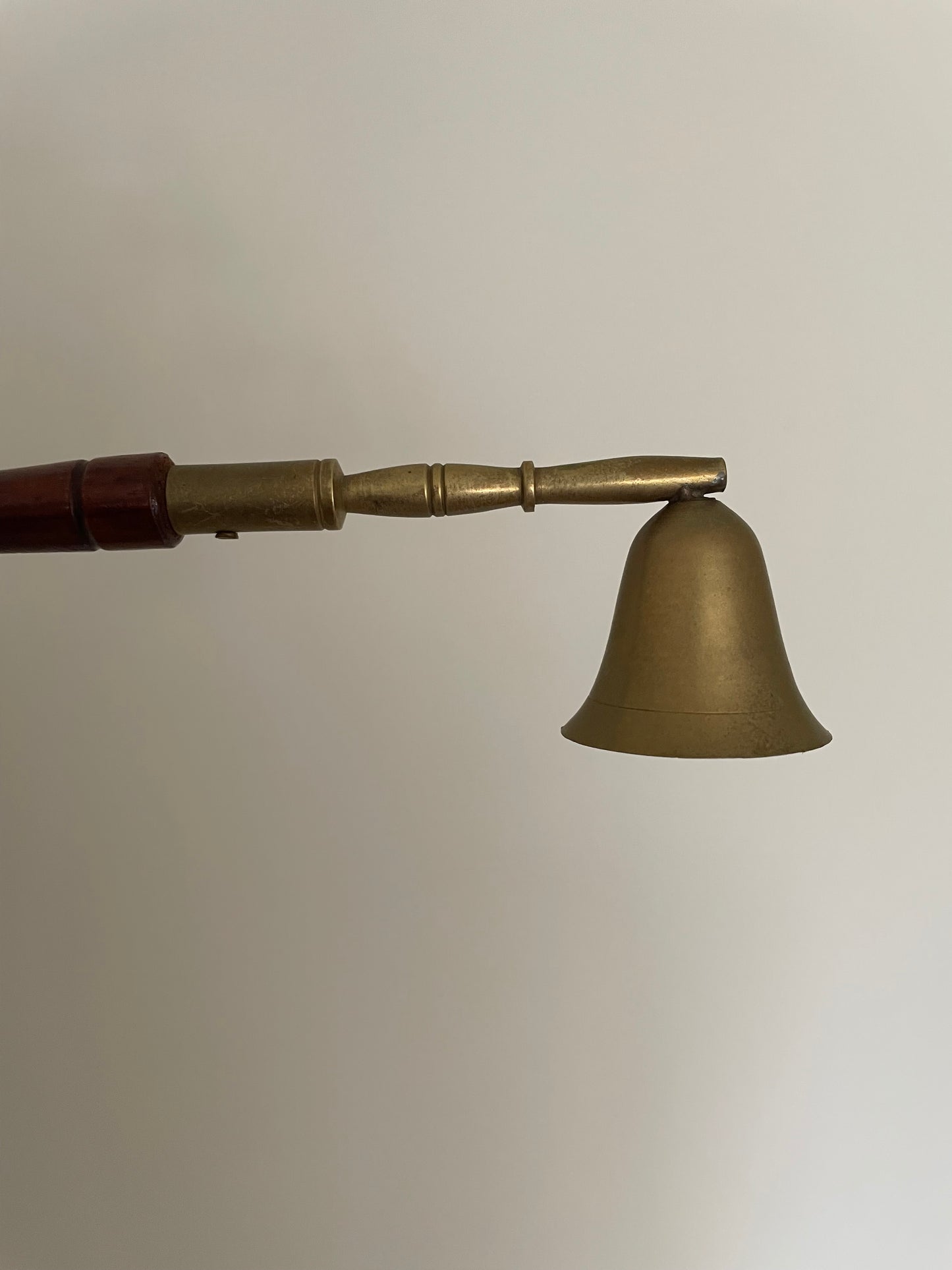 Brass and wooden candle snuffer