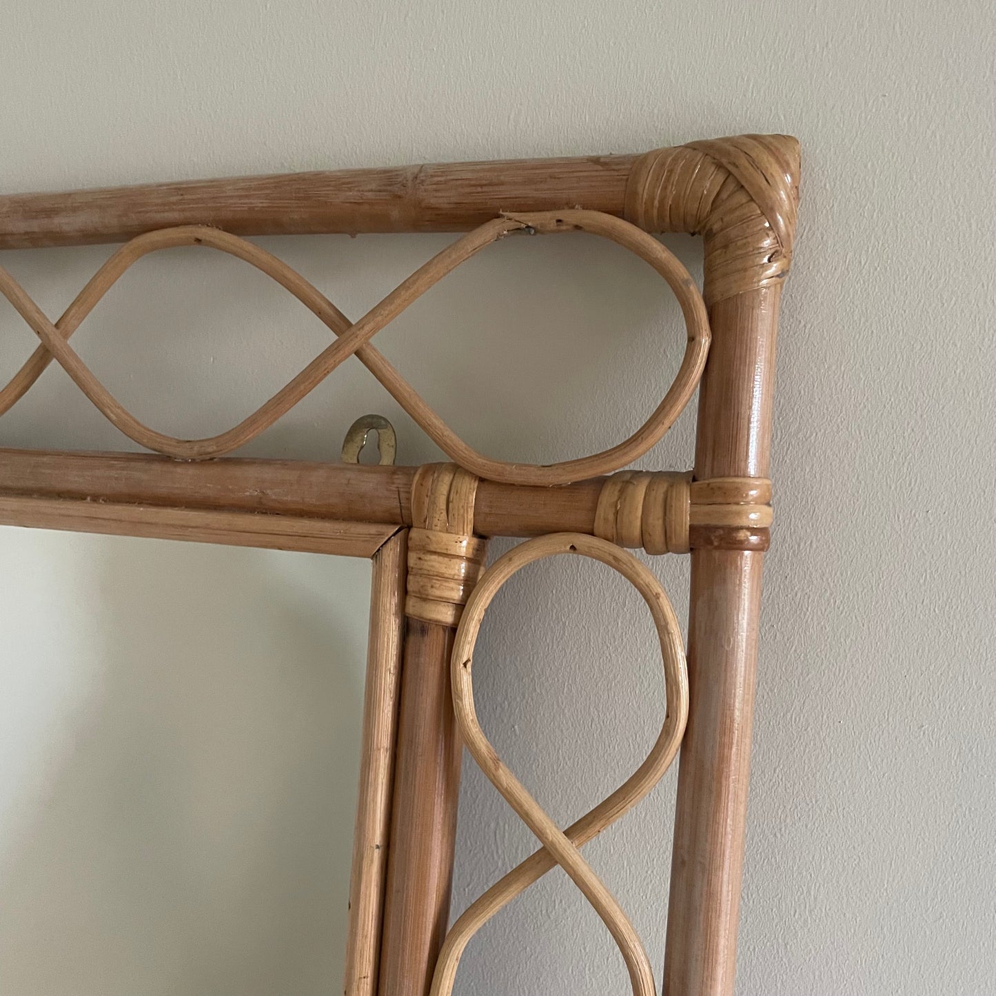 Bamboo and rattan vertical mirror with swirls