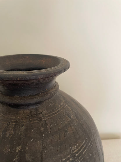 Dark wooden vintage vase