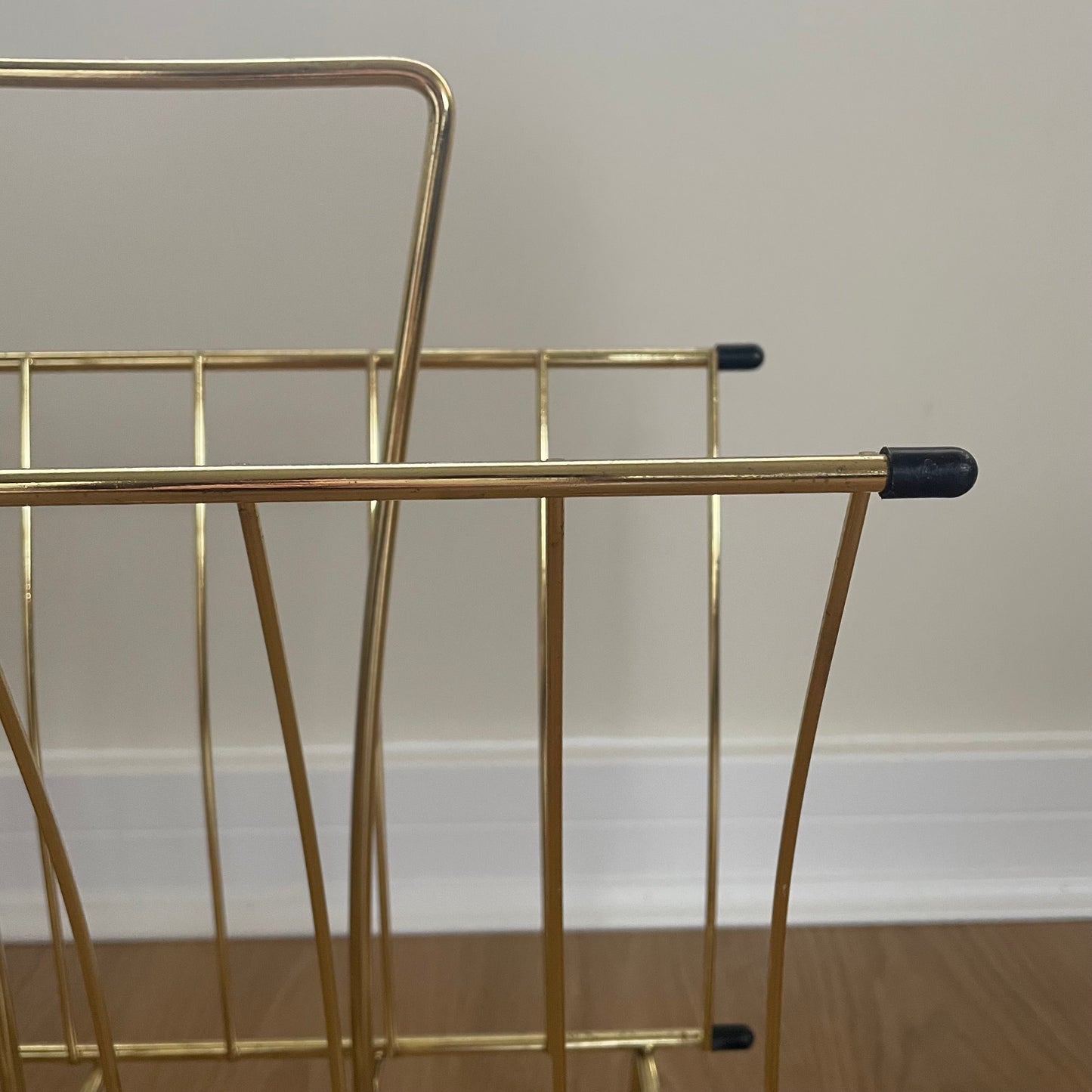 Gold metal magazine rack