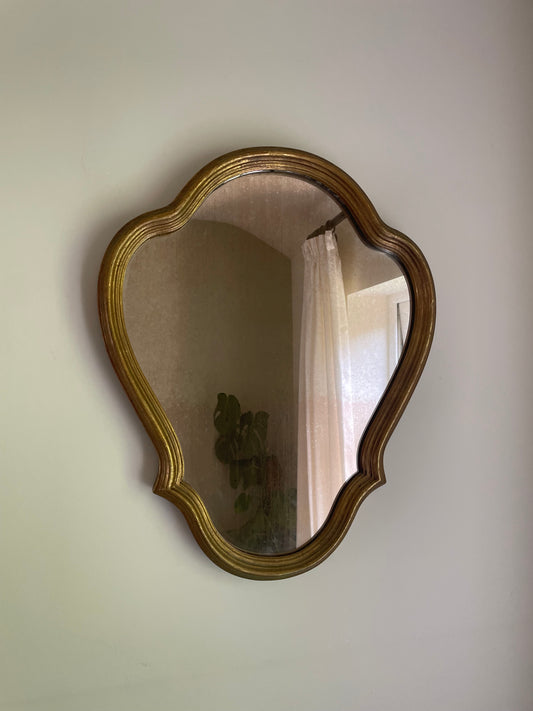 Scalloped wooden gilt wall mirror