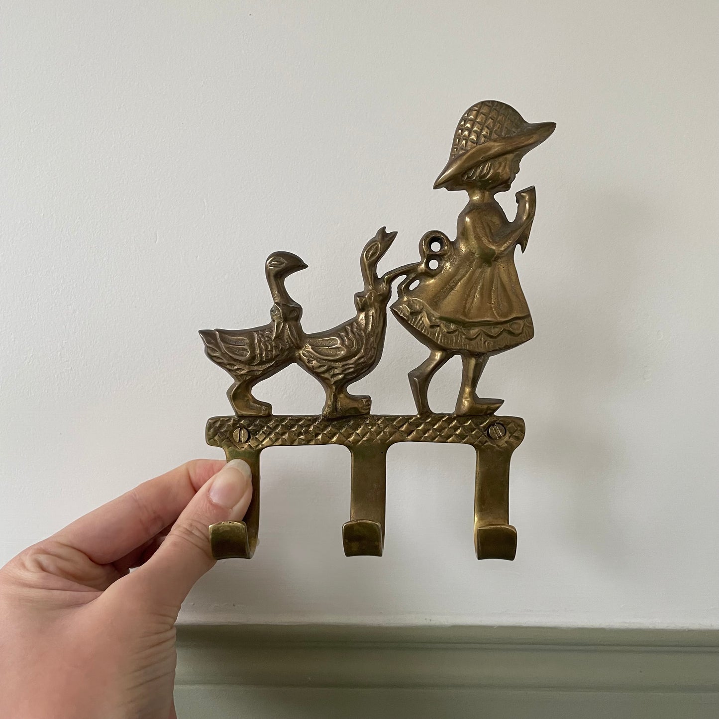 Brass girl and geese wall hook with three pegs