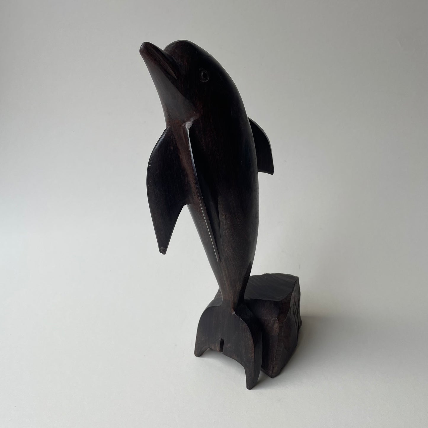 Large wooden dolphin statue