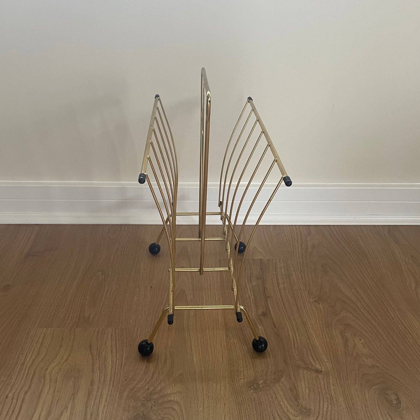 Gold metal magazine rack