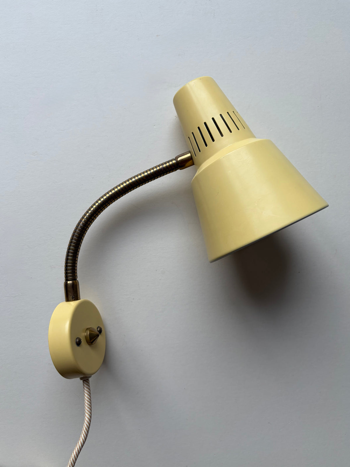 Vintage butter yellow small midcentury wall light with brass gooseneck