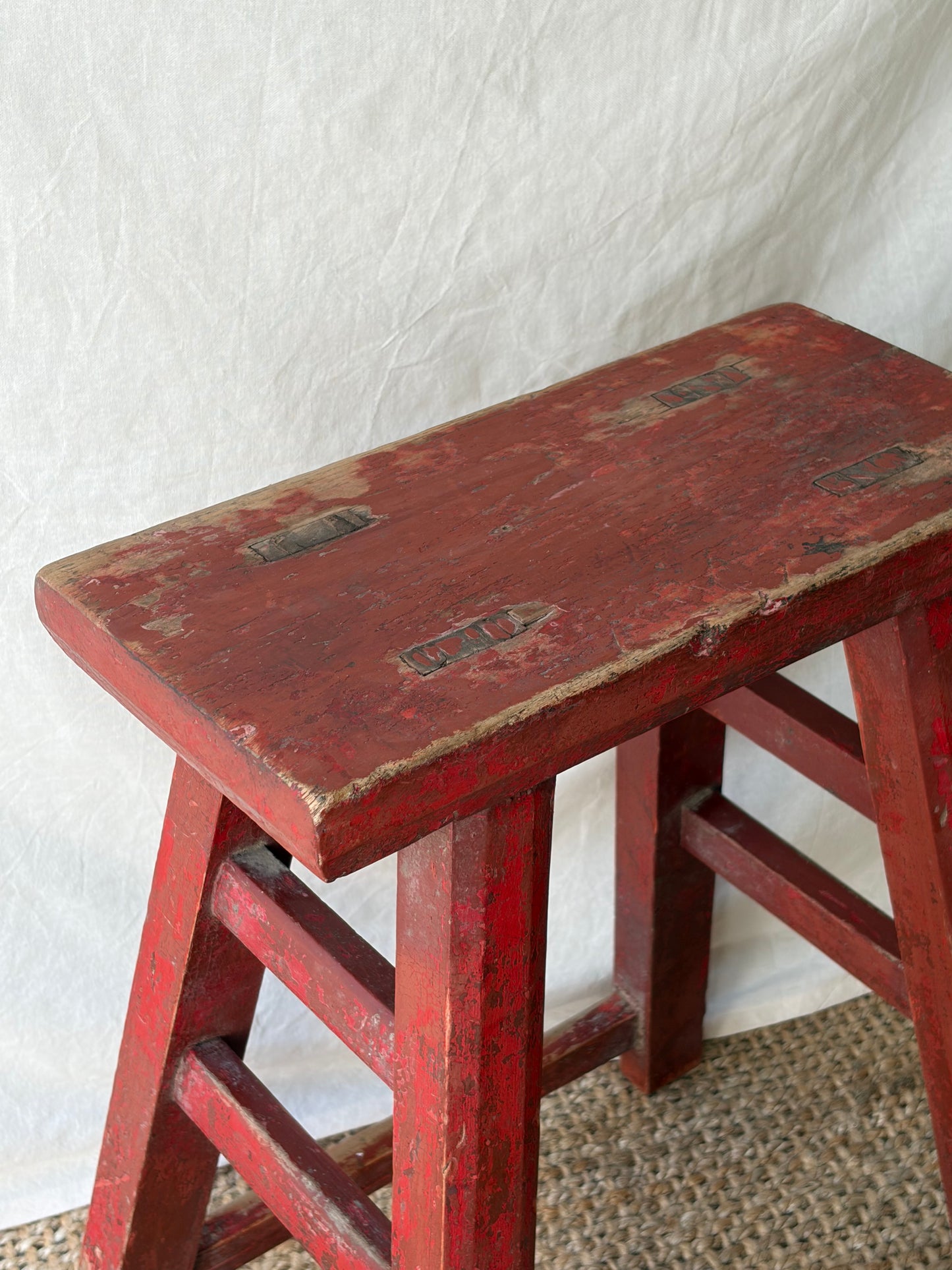 Vintage rustic red chipped wooden stool