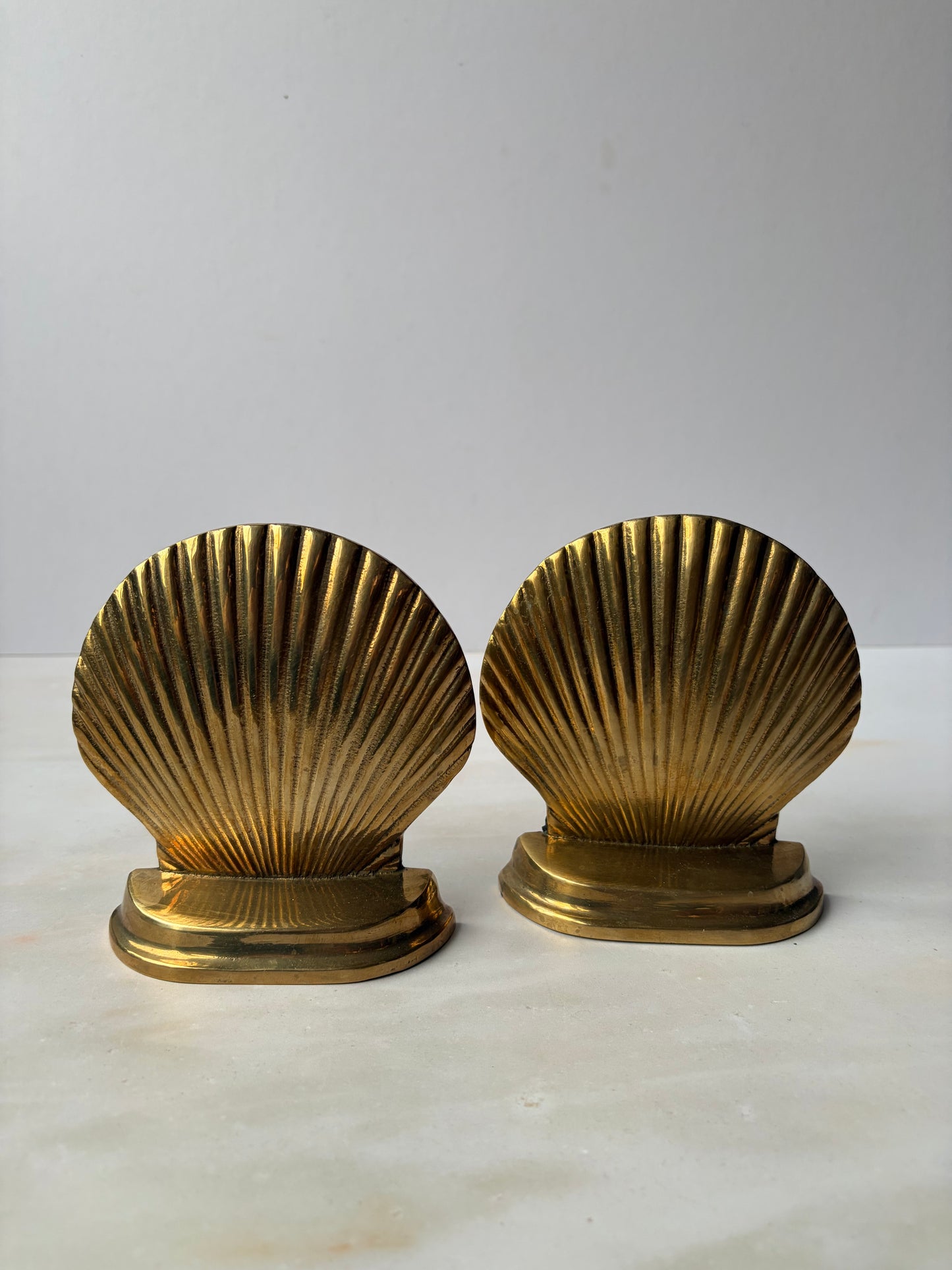 Pair of vintage solid brass shell bookends