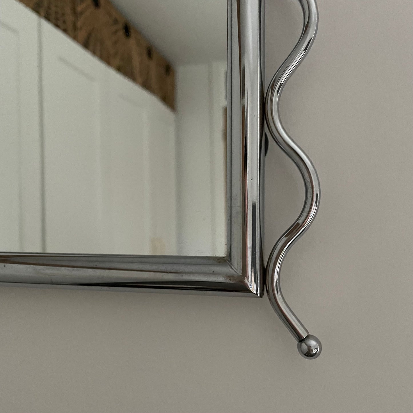 Chrome vintage mirror with wavy edges