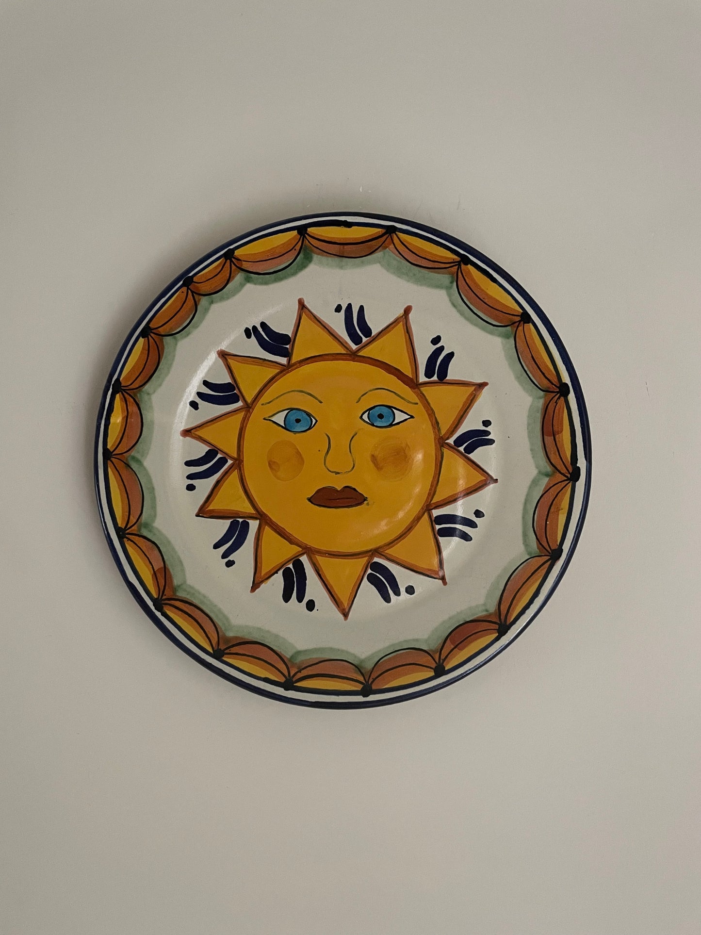 Vintage hand painted Mexican wall plate of sun