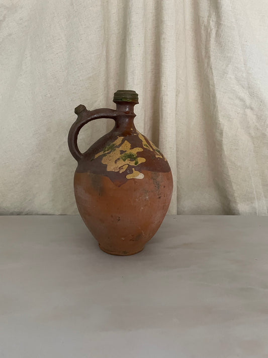 Terracotta jug with yellow