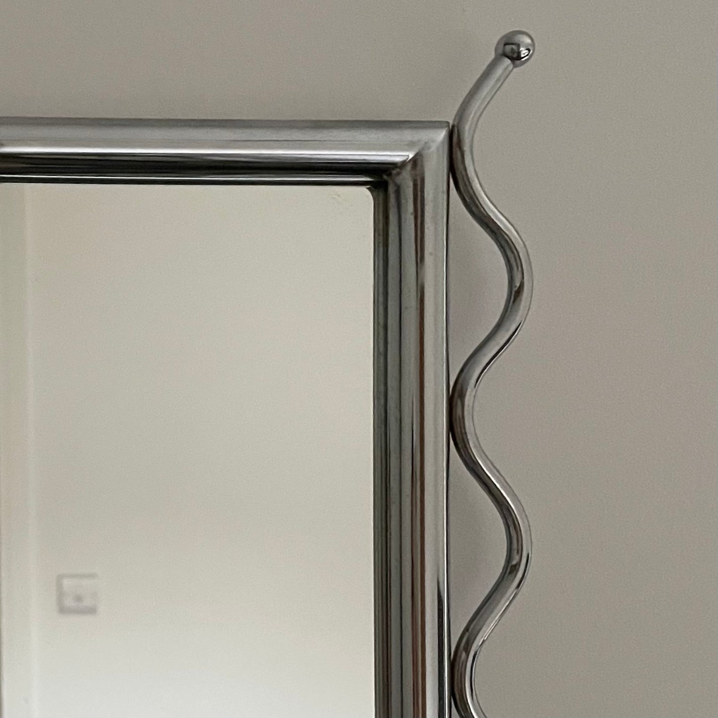 Chrome vintage mirror with wavy edges