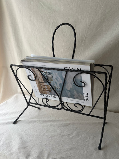 Vintage iron magazine rack with twisted and scroll details