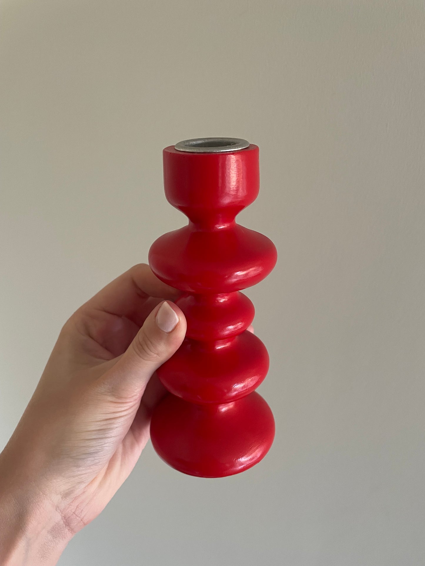 Vintage pair of red wooden bobbin candlestick holders