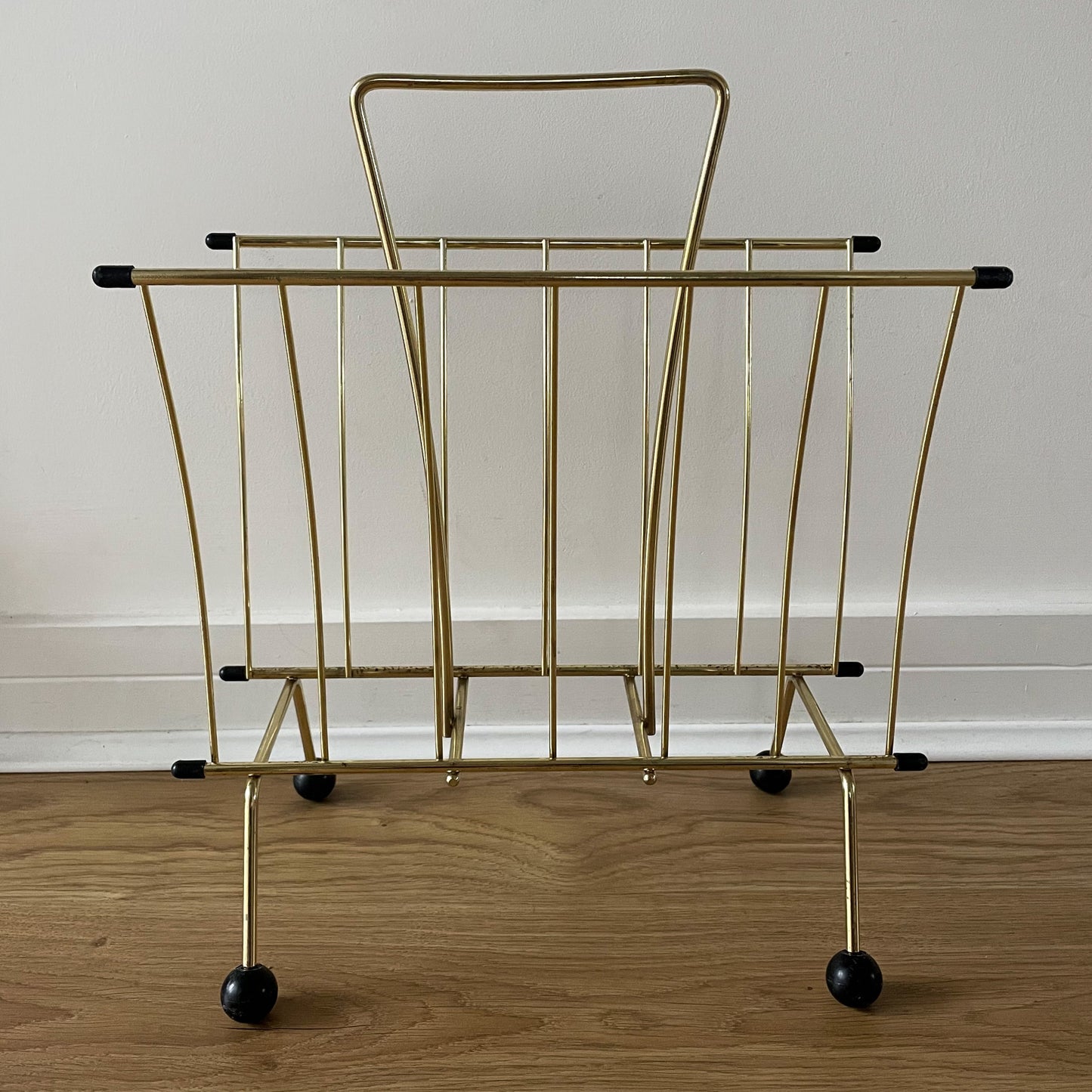 Gold metal magazine rack