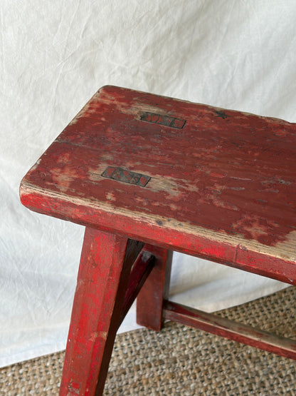Vintage rustic red chipped wooden stool