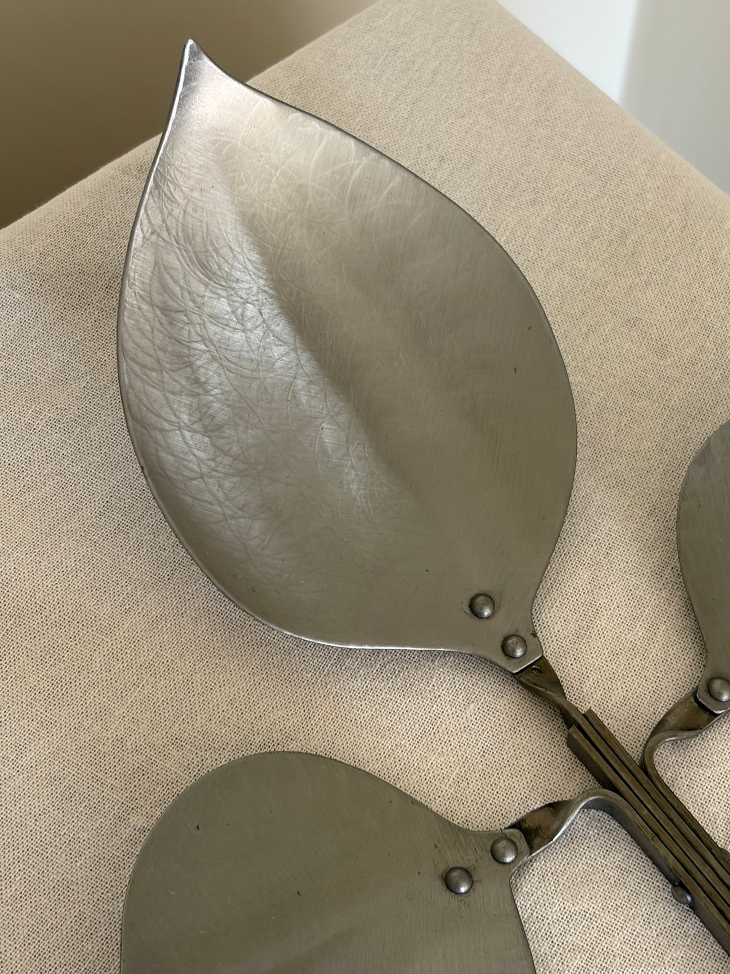 Pair of vintage pewter leaf shaped candle sconces