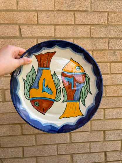 Vintage hand painted Mexican wall plate of colourful fish