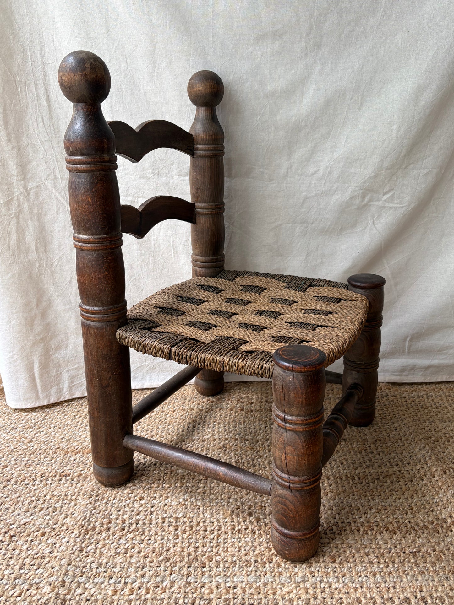 Low oak rush-seat chair attributed to Charles Dudouyt
