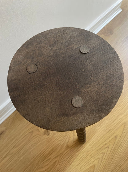 Antique French stool with wavy legs and round top