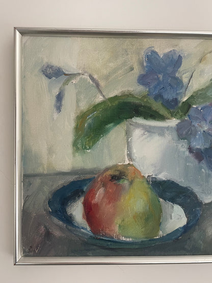 Still life of apple and violets