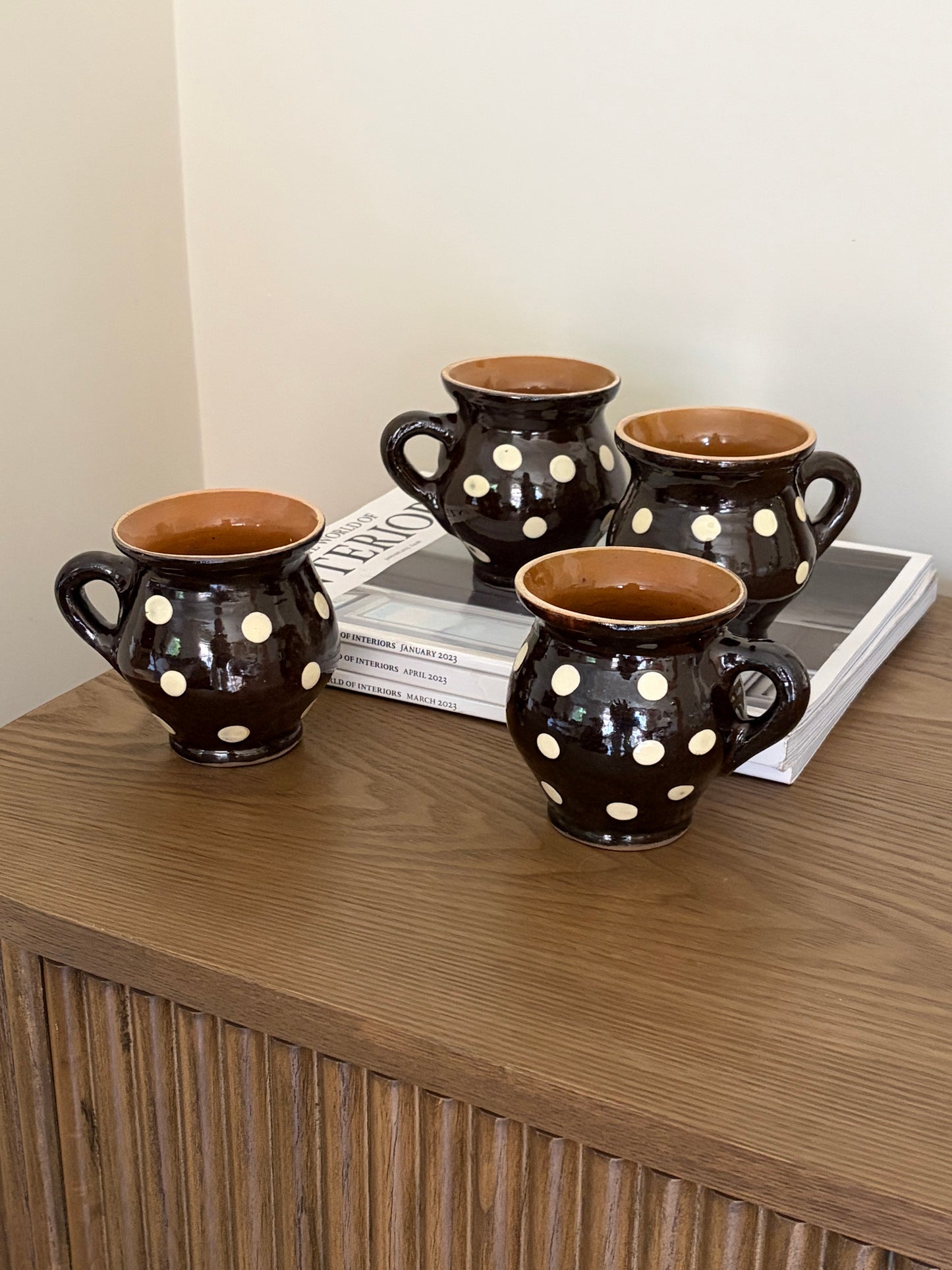Romanian brown small jugs with cream dots — set of four