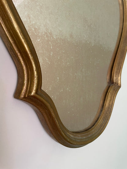 Scalloped wooden gilt wall mirror