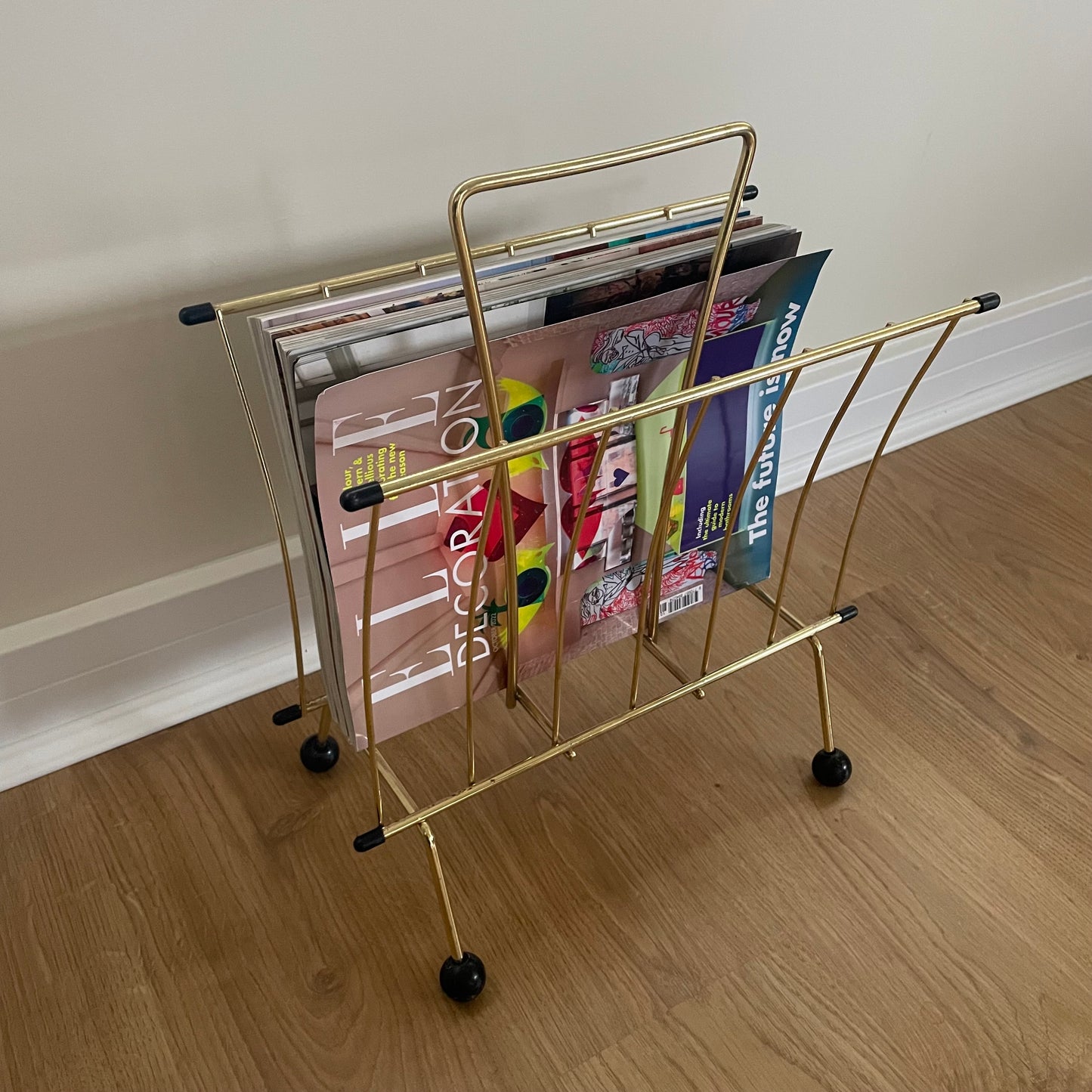 Gold metal magazine rack