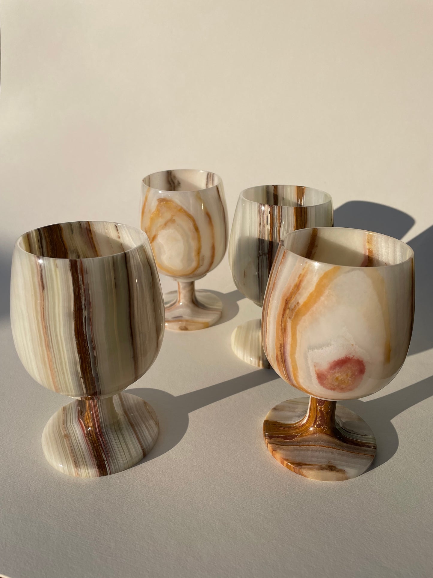 Set of four onyx white and brown goblets