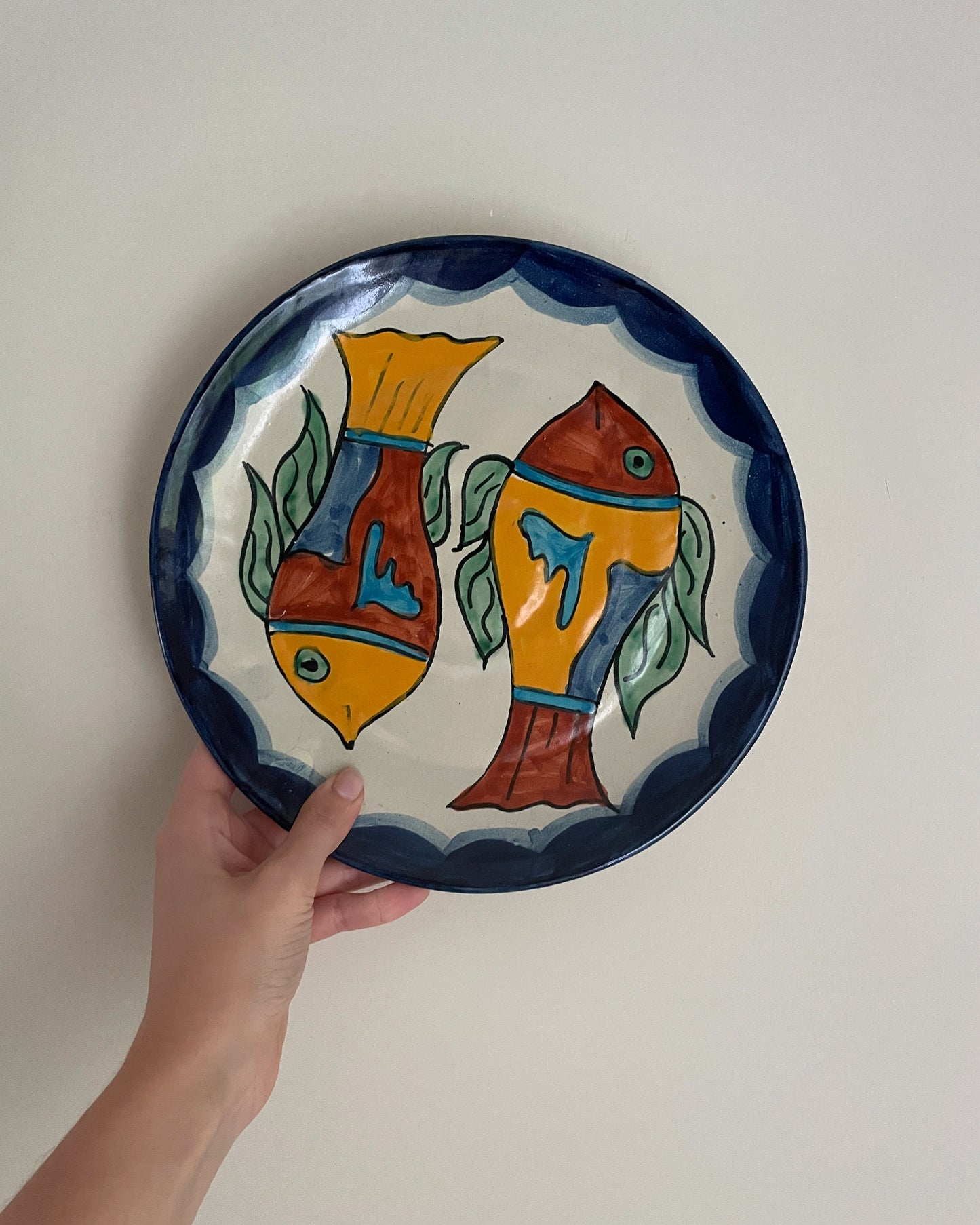Vintage hand painted Mexican wall plate of colourful fish