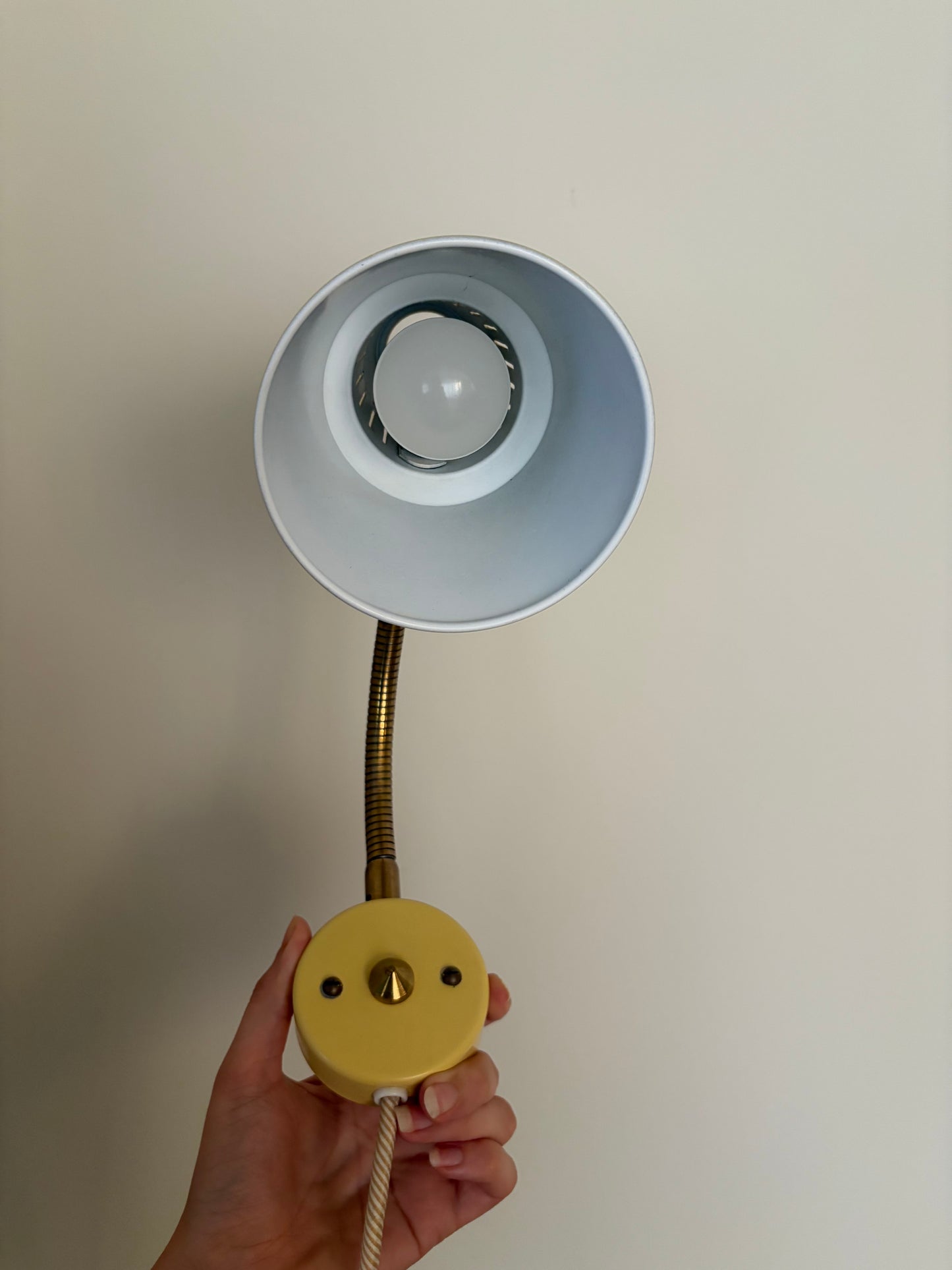 Vintage butter yellow small midcentury wall light with brass gooseneck