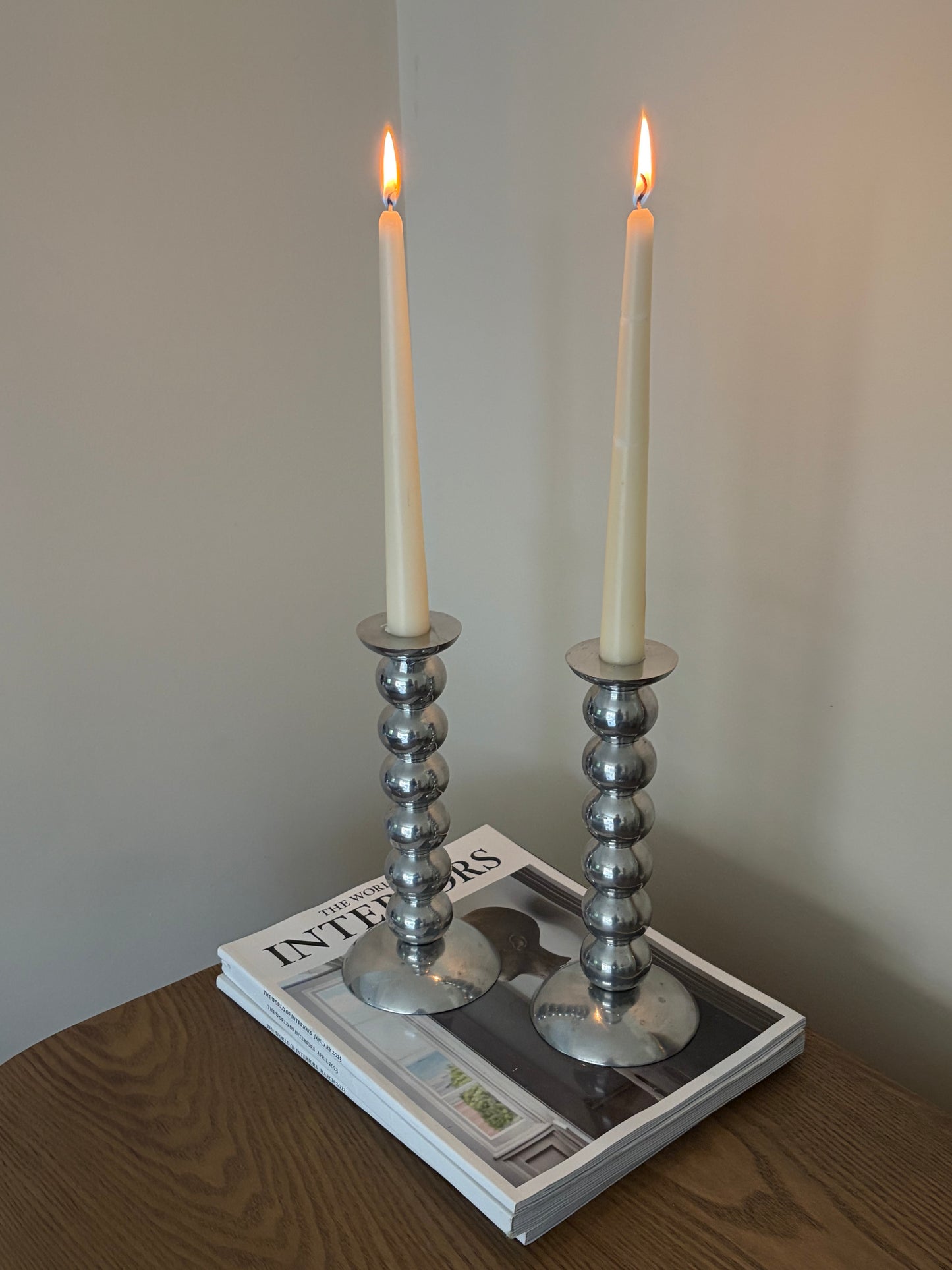 Pair of vintage cast aluminium bobbin candlesticks