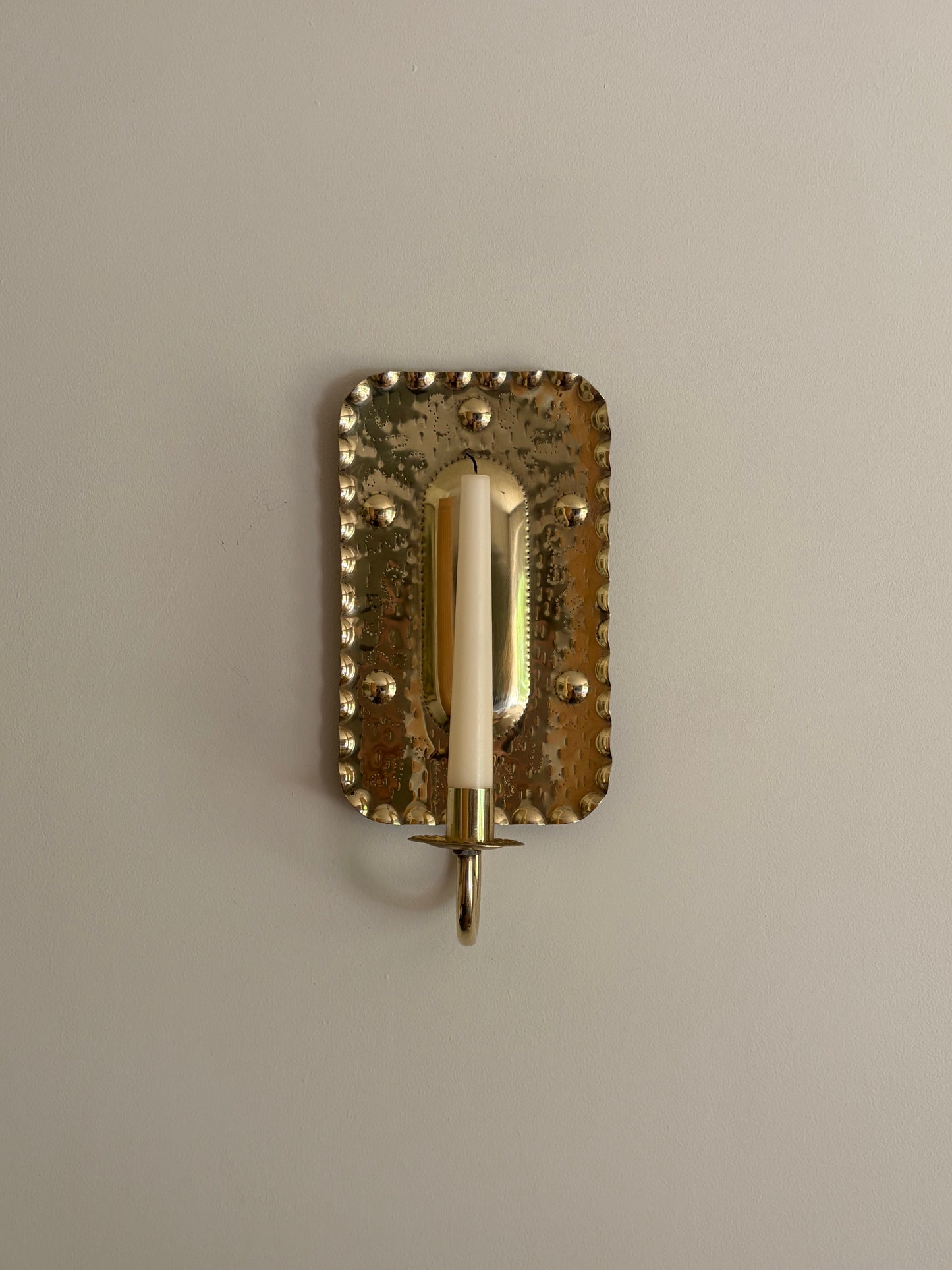 Pair of vintage brass candle sconces in a rectangular embossed design, Sweden