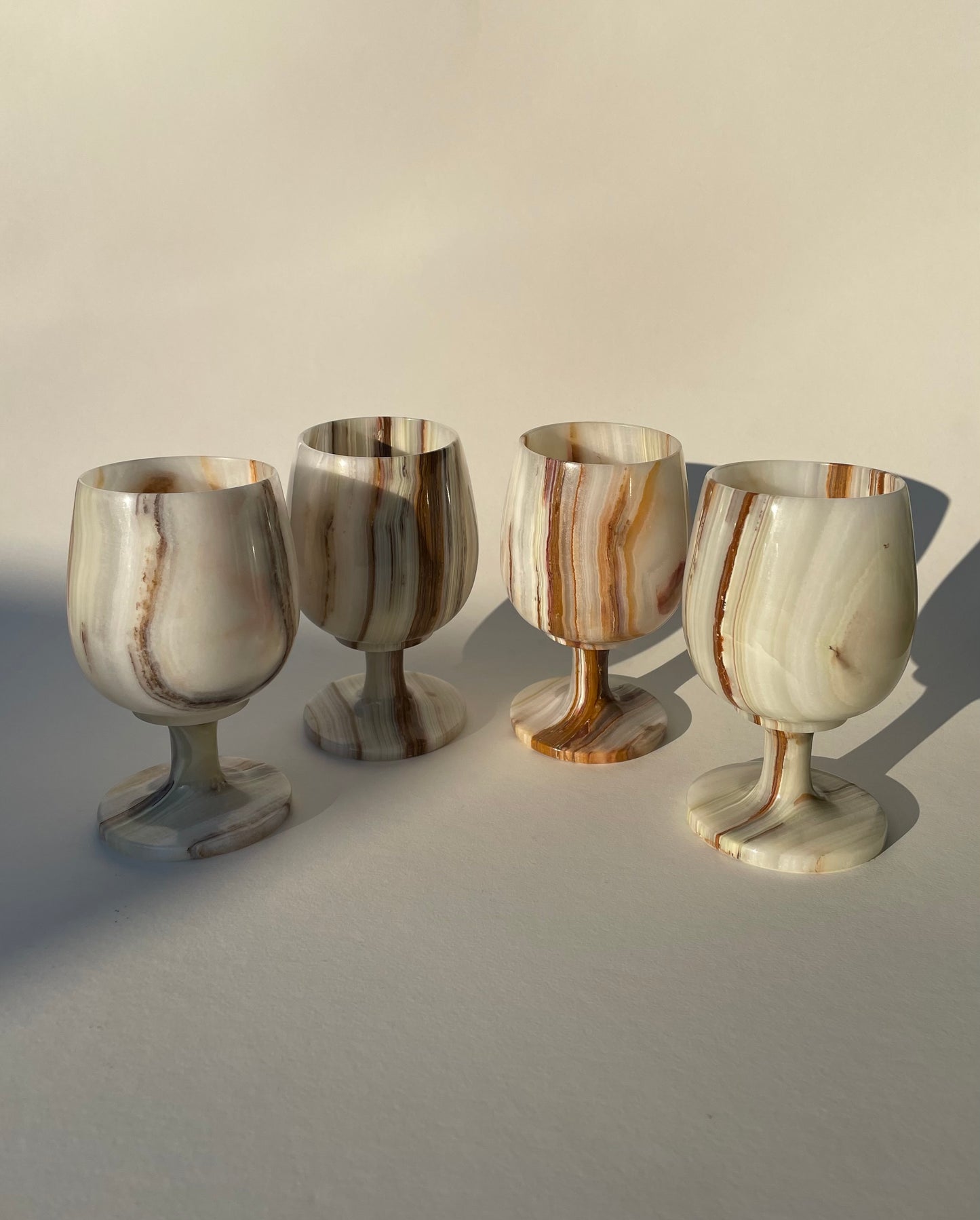 Set of four onyx white and brown goblets