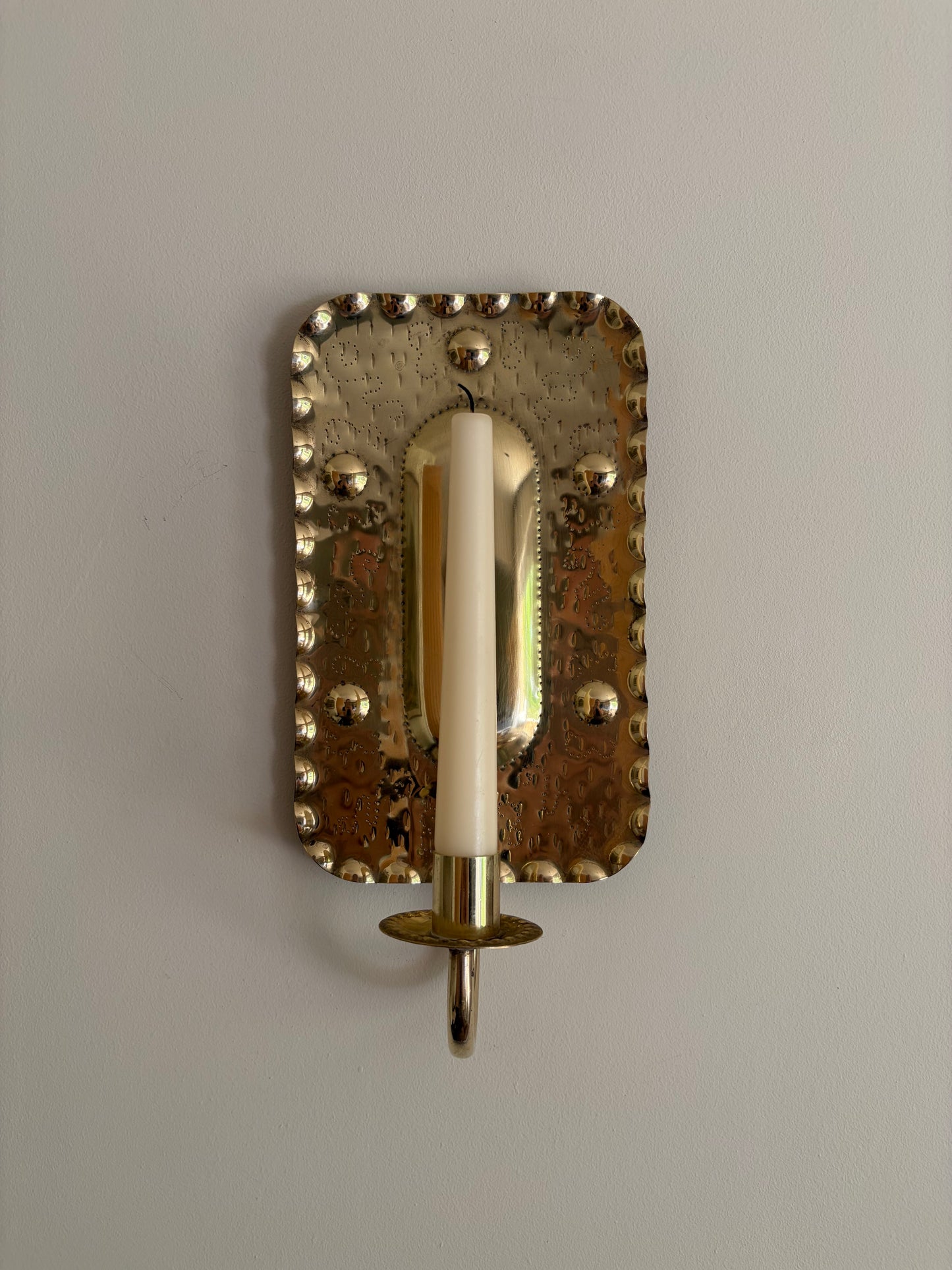 Pair of vintage brass candle sconces in a rectangular embossed design, Sweden