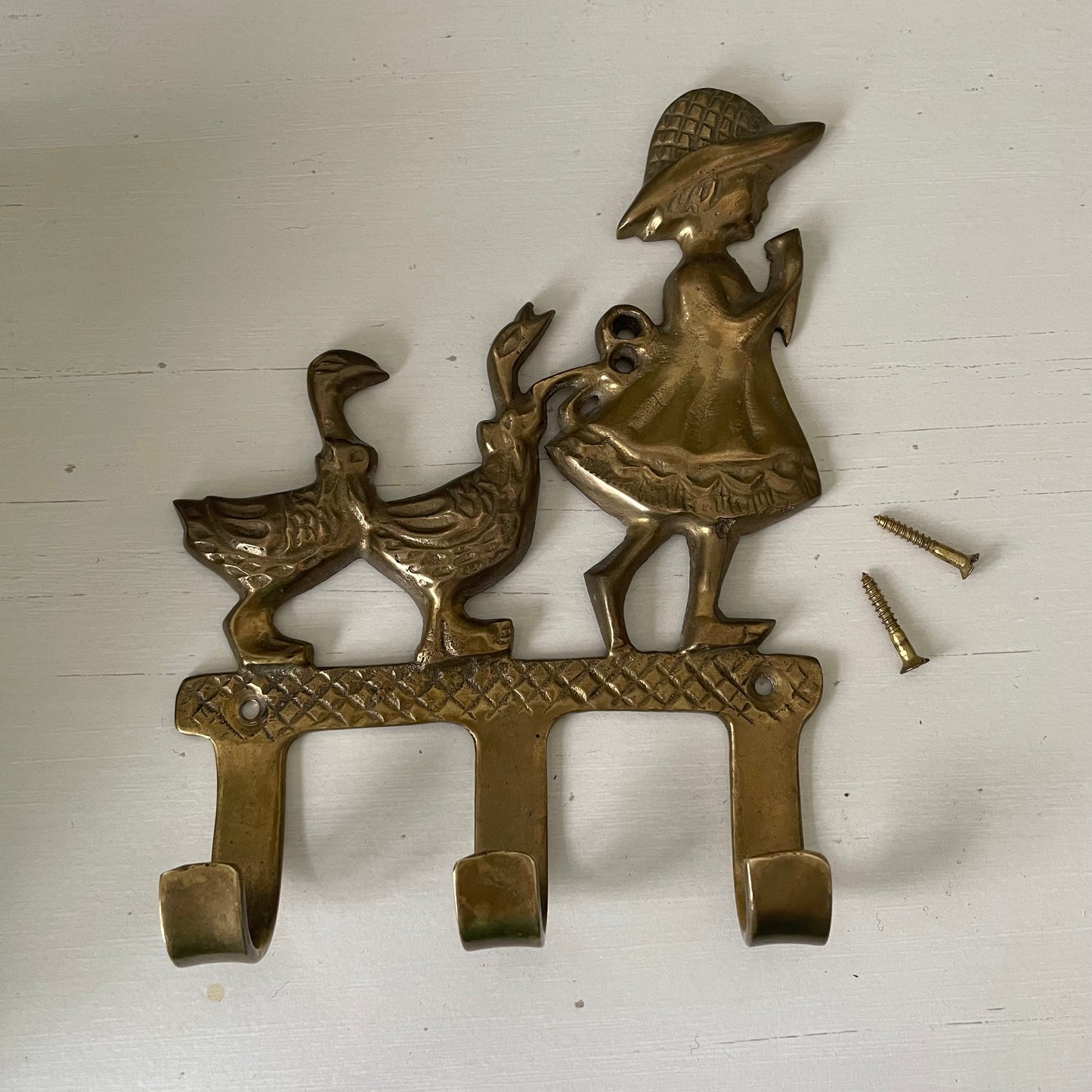 Brass girl and geese wall hook with three pegs