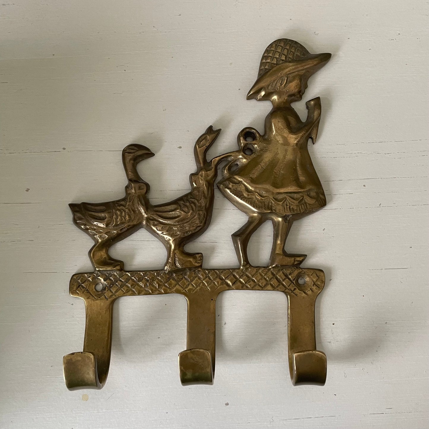 Brass girl and geese wall hook with three pegs