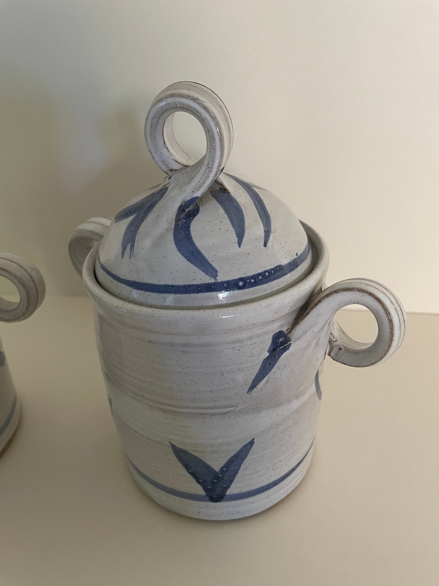 Pair of ceramic handmade canisters in blue and white