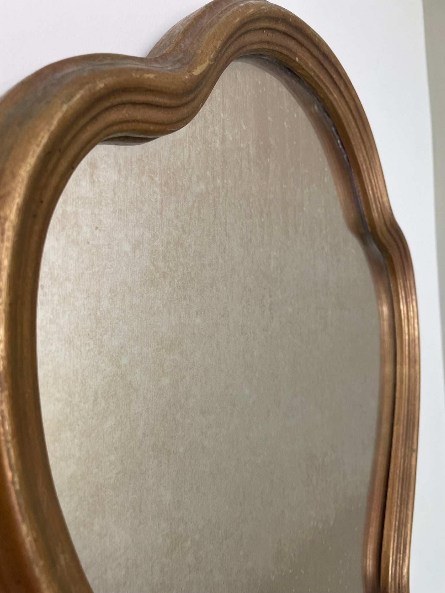 Scalloped wooden gilt wall mirror