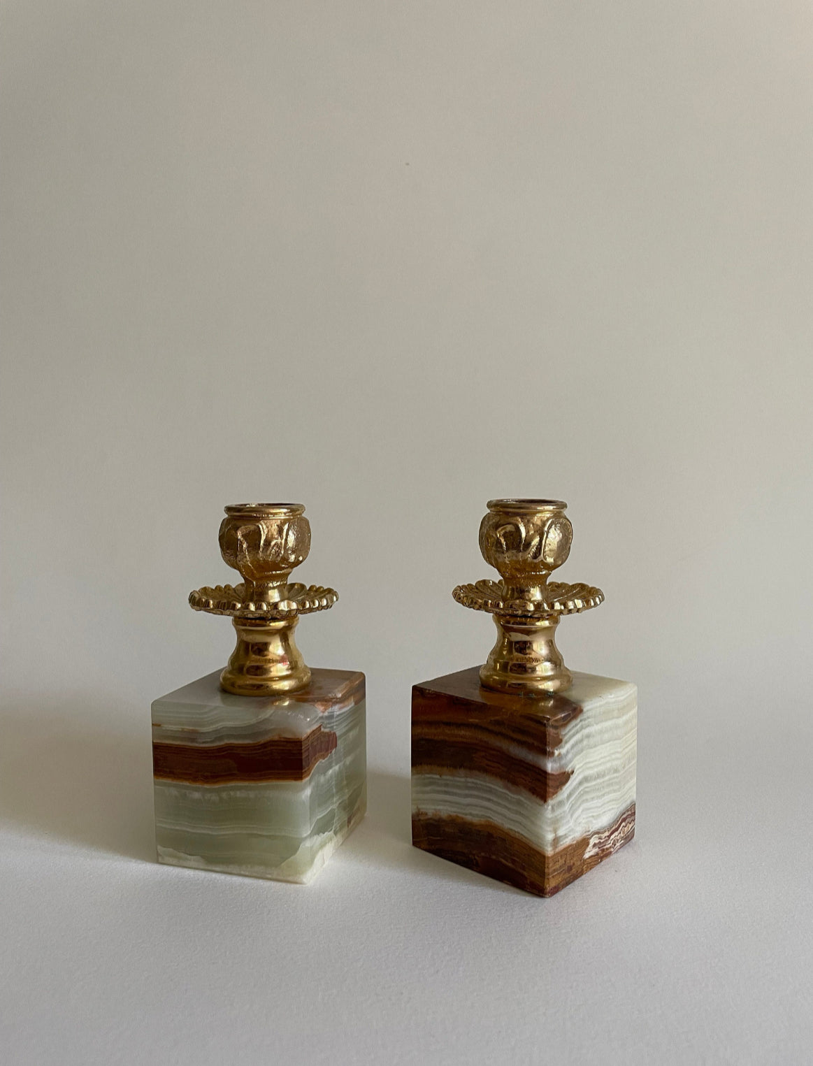 Pair of onyx candle stick holders with gilded metal