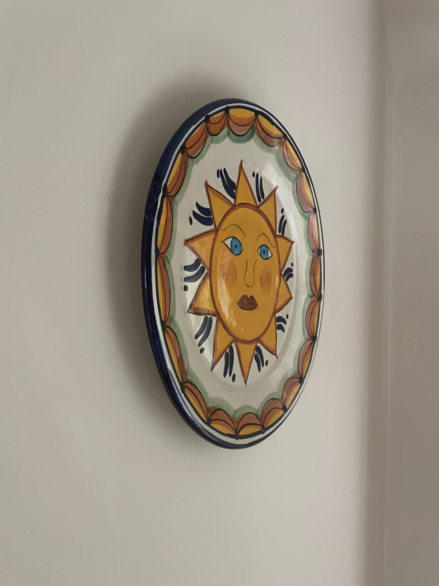 Vintage hand painted Mexican wall plate of sun