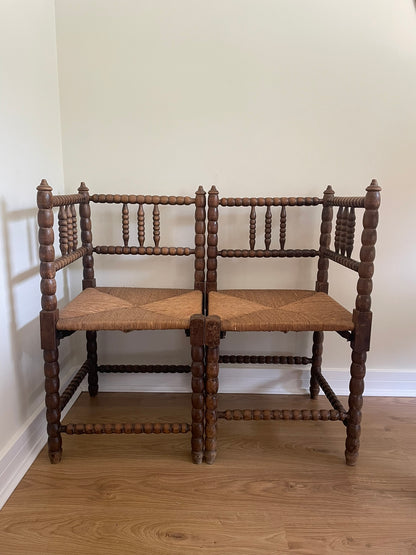 Antique turned oak corner chair with rush seat
