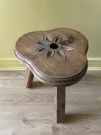 Vintage French wooden milking stool with carved flower