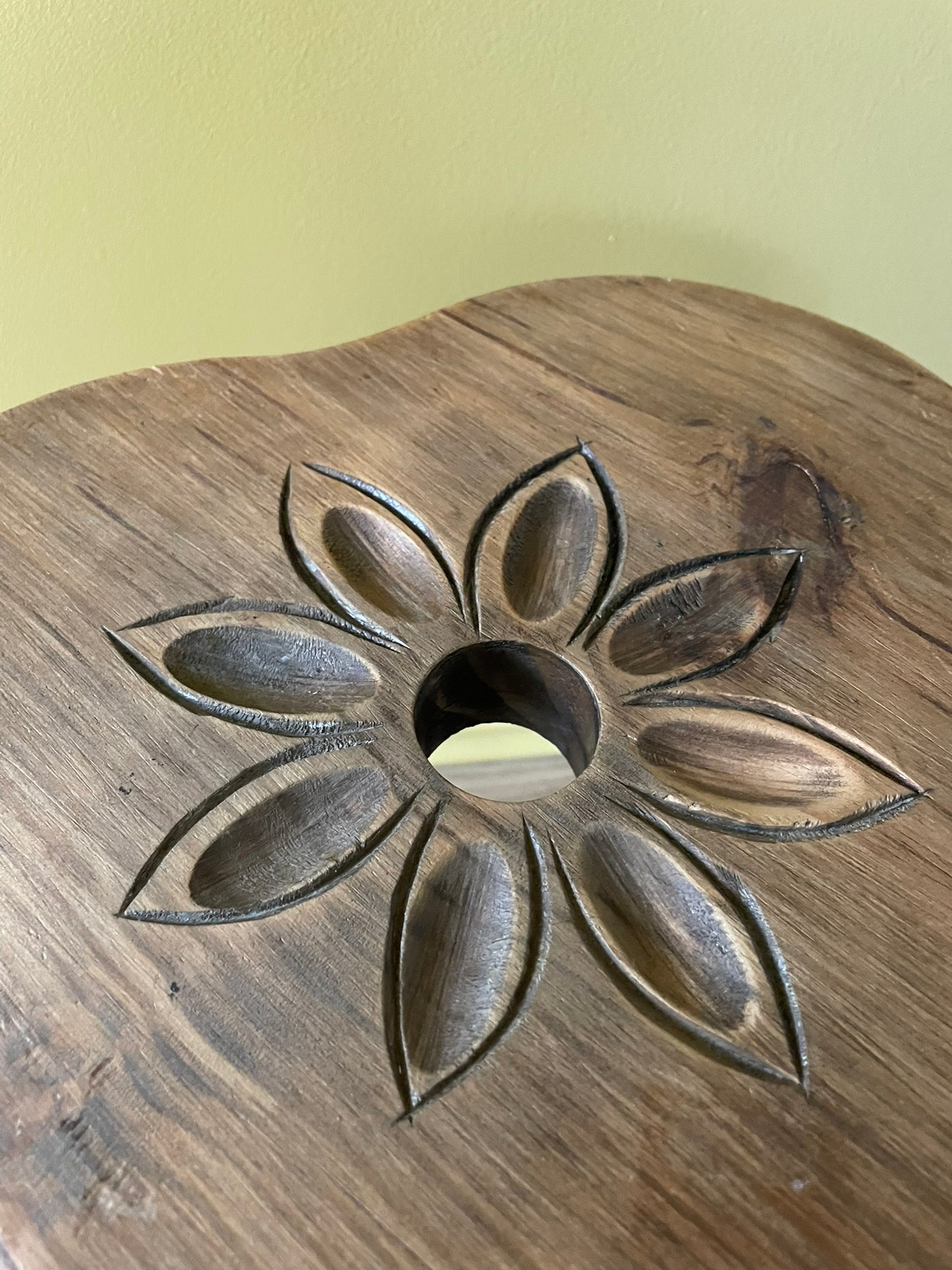 Vintage French wooden milking stool with carved flower