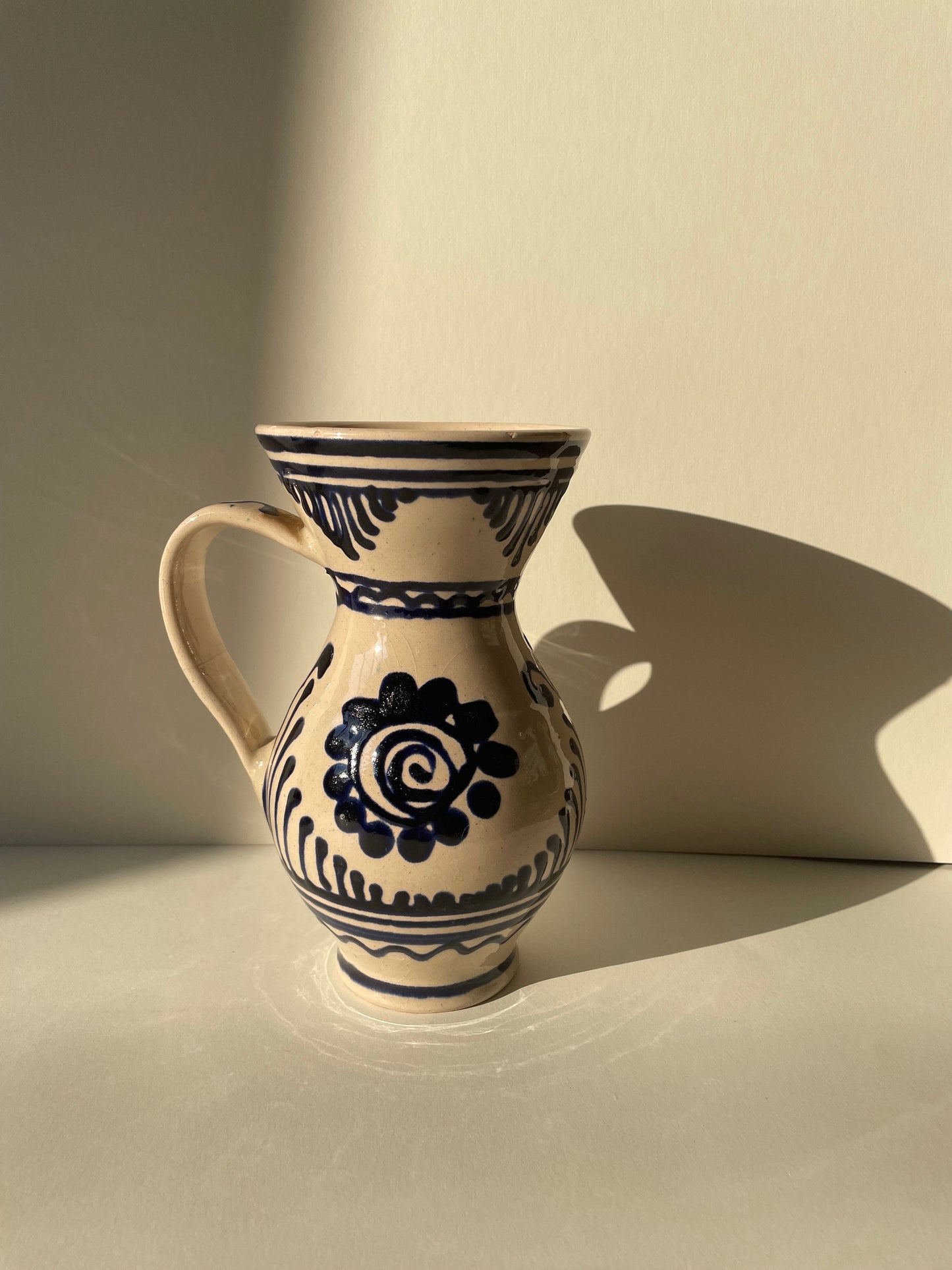 Vintage handmade ceramic pottery vase / jug with blue details